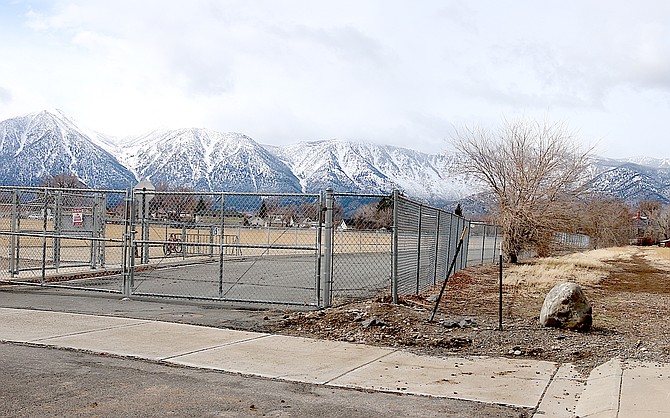 Giles ends in a gate to Gardnerville Elementary School on the left and the proposed entrance to a 29-unit development to the right.