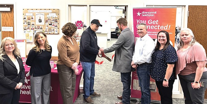 Mayor Ken Tedford and Commission Chairman Myles Getto cut the ribbon March 5 at the new telehealth center inside the William N. Pennington Life Center. From left: Jill Manha, Shannon Ernst, Cheri Glockner, Tedford, Getto, Eric Blakey, Brittany Burton and Jackee Stewart.