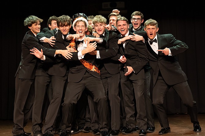 Mr. DHS Xander Bacon's competitors celebrate his victory.