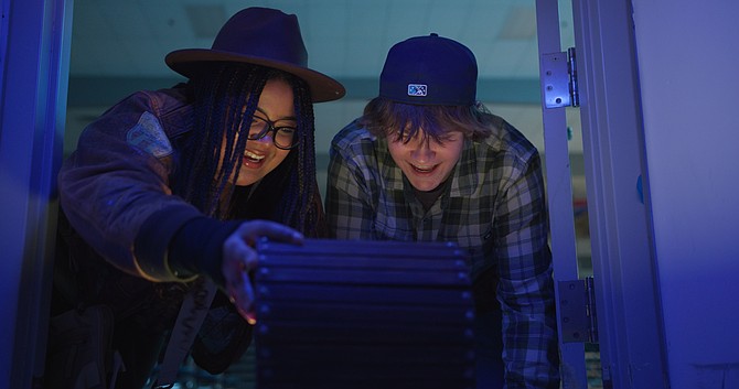 Iliana Jones (played by Lily West) and Tall Square (played by Ryan Nelson) are excited during part of the movie "Iliana Jones and the Lost Donation"