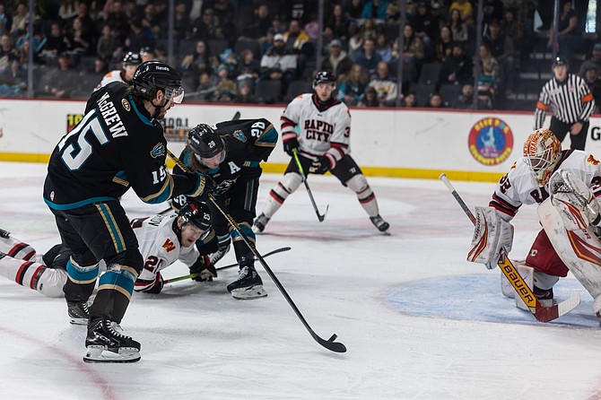 Jake McGrew flicks a wrist shot against Rapid City this past weekend. McGrew had two goals and two assists in the three-game series, helping the Knight Monsters win two of three.