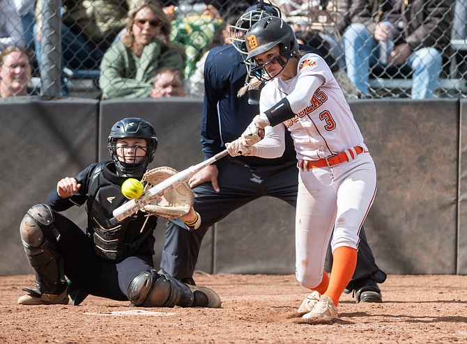Douglas High senior outfielder Annie Hill connects against Bishop Manogue last weekend. Hill was a first team all-region player last spring and will be senior leader on this year's squad.