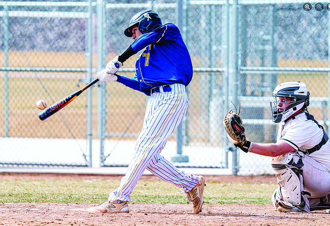 Lowry's Zaq Growcock puts the ball in play during Saturday's doubleheader with Hug in Reno