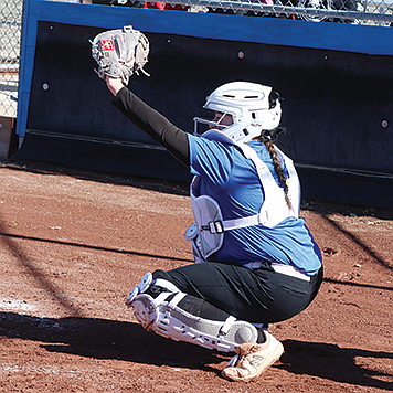 Lowry's Dana Micone catches a pitch during a scrimmage with Spring Creek at the end of February,