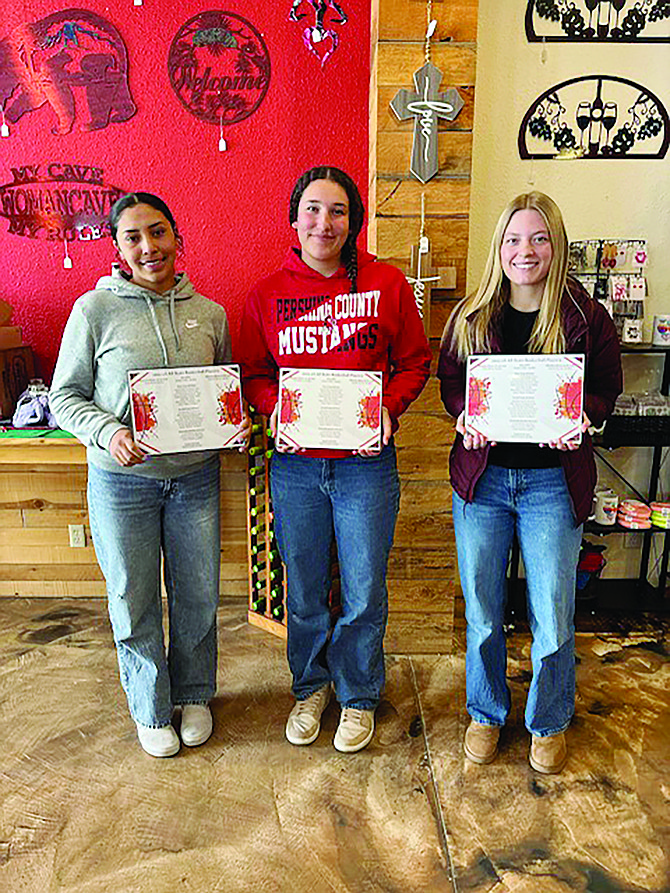 Riley Harvey, Aaliyah Allen and Khloe Montes display their all-state basketball awards.