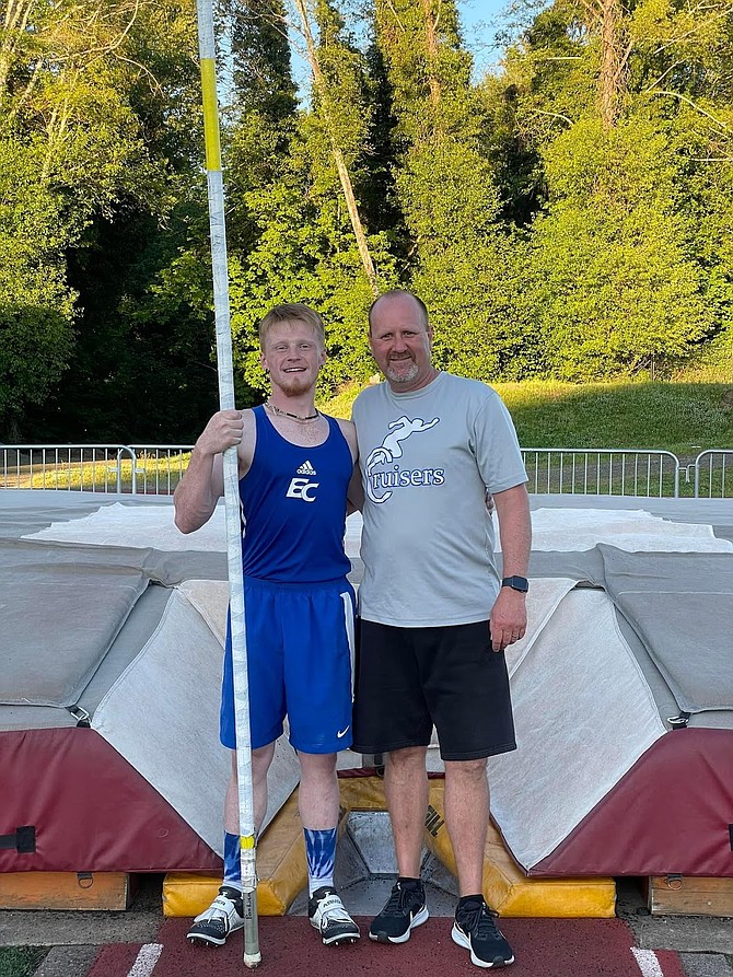 Eatonville High School senior Ethan Carter stands with Coach Geoff Olsen last season when he broke the school record. Carter broke that record at the season-opening meet on Saturday.