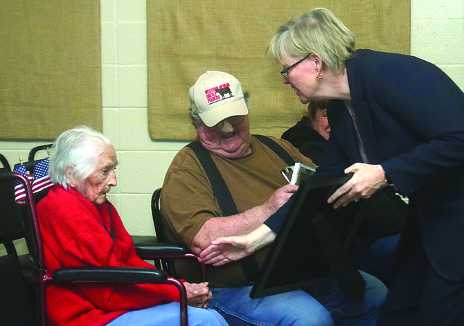 Mary Devine, right, director of the Nevada Department of Veterans Services, presented Gov. Joe Lombardo’s proclamation commending 105-year-old Mercedes Starr of Lovelock for her service during World War II in the Navy WAVES. To their left is Craig Starr, Mercedes son.