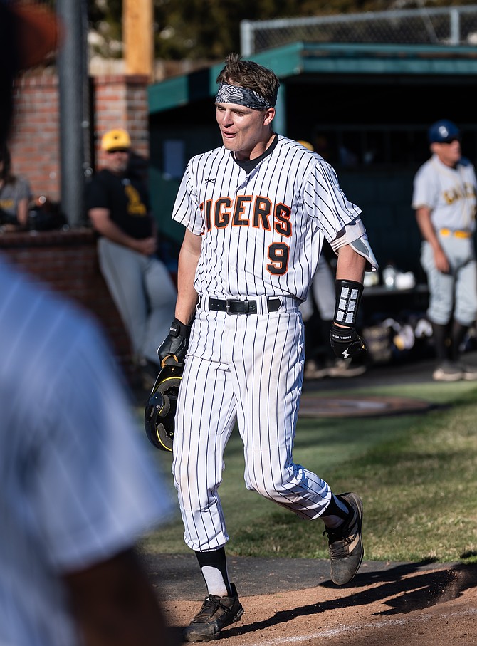 Douglas High’s Jackson Ovard approaches home plate after hitting a go-ahead grand slam against Galena on Tuesday.