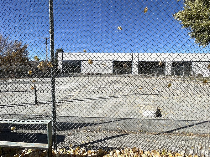 Dilapidated tennis courts at Mills Park in 2024, where six new pickleball courts will be constructed.