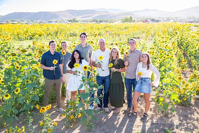 Cameron and Natalie Andelin with their children on their 150-acre farm off Pyramid Highway.