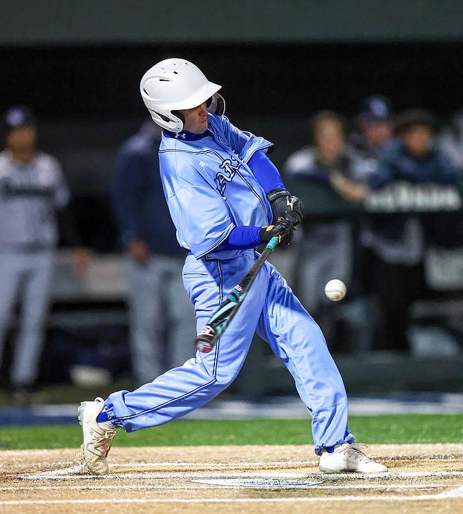 Carson High’s Will Raggett connects with his game-winning single in extra innings Thursday evening at Peccole Park. Raggett’s RBI base hit gave the Senators a 4-3 win over Damonte Ranch, marking the team’s second walk-off win in the last five days.
