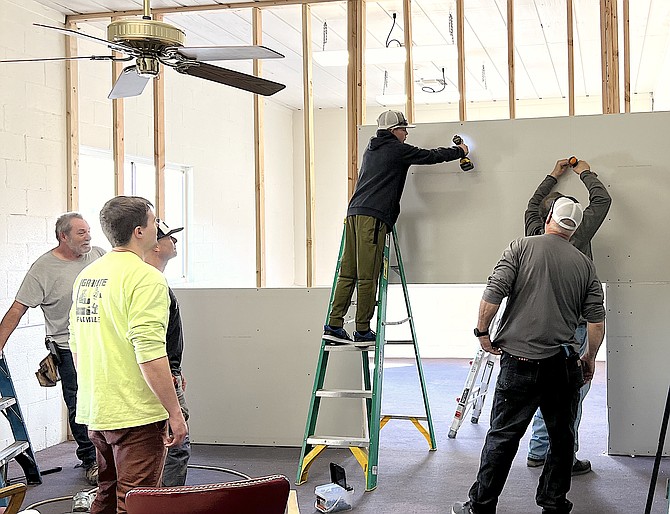 Western Nevada construction students work on a new wall for the Genoa Town Manager's office.