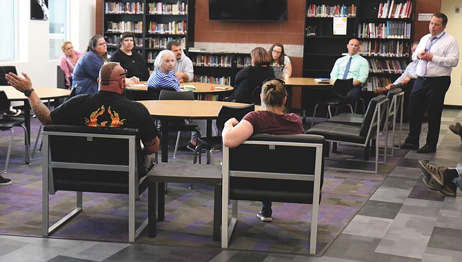 Carson City School Superintendent Andrew Feuling, far right, addresses Pioneer Academy families in May 2024 about proposed changes.