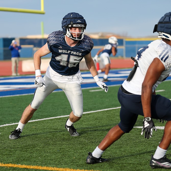 Chris Smalley shadows a receiver Friday during the Nevada football team’s scrimmage at Carson High School. Smalley, a 2021 Douglas High graduate, is a senior.