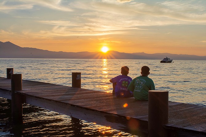Youth at the 4-H Camp at Lake Tahoe enjoy a sunset on the dock. 
Photo by Robert Moore.