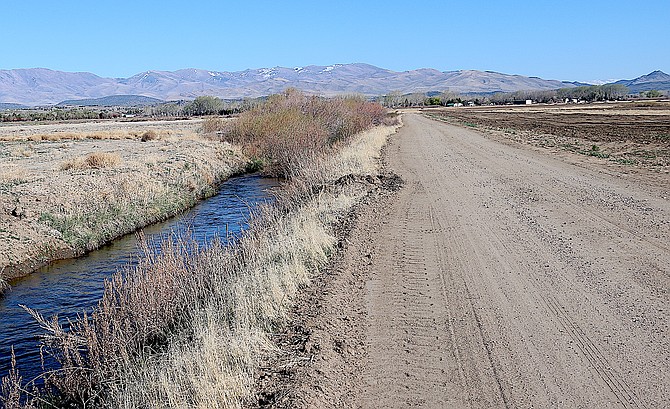 The Old Virginia Canal follows the alignment of Muller Lane Parkway south of Buckeye on Thursday evening.