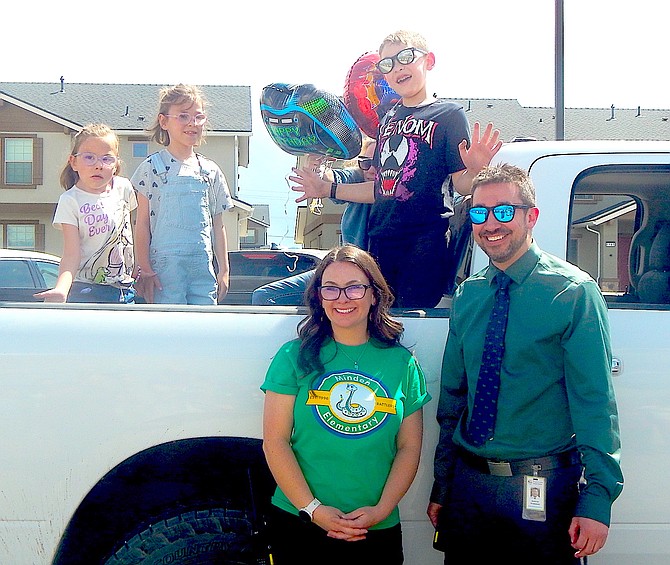 Annie, Abby, and Dean Godecke with Minden Elementary School’s nurse Tawny Spires and Principal Andrew Fromdahl during the “welcome back Dean” and birthday celebration on Wednesday.