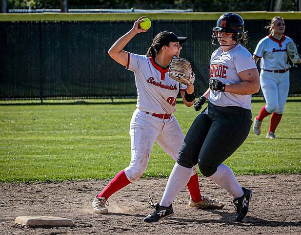 After making the tag at second, Panther Amelie Lopez fires a shot to first for a possible double play during the game Tuesday, April 15. The Monroe Bearcats rolled to a  9 - 5 conference win over the Snohomish Panthers.