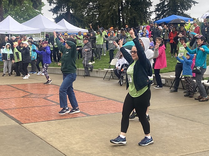 Walkers can take part in a Zumba warm-up before heading out.