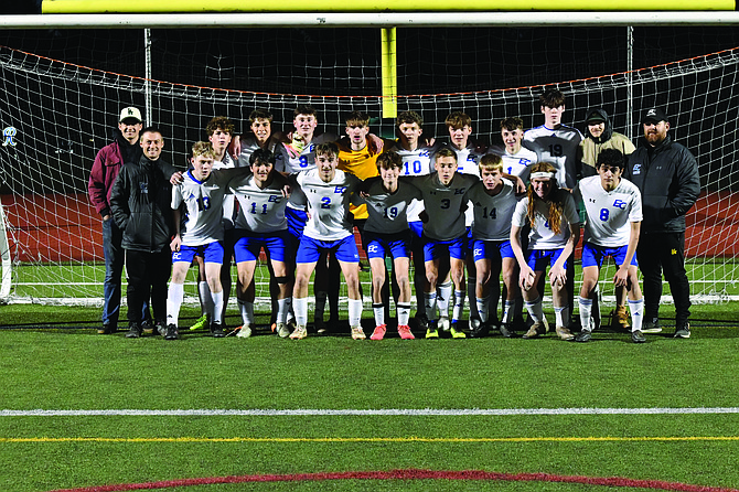 The Eatonville Cruiser soccer team pose for a photo following their 3-1 defeat of the Foss Falcons, notching their first victory of the season.