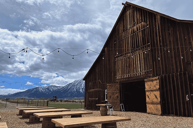 The 121-year-old barn at Park Home Ranch is framed by the Sierra Nevada mountains in Minden. The venue will host its wedding open house on Sunday.