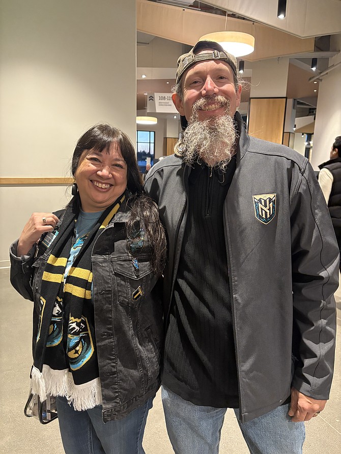 Anita and Mike Kelley pose for a photo at the Tahoe Knight Monsters’ first-ever home playoff game. The Kelleys attend Knight Monsters games as fans and work at the Tahoe Blue Events Center part-time.