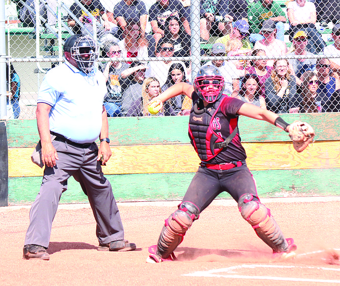 Pershing County's Aaliyah Allen attempts to throw out a Battle Mountain runner at second base.