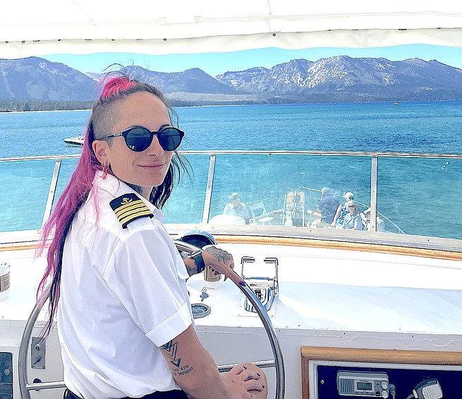 Keely Pereira helms a boat at Lake Tahoe as a professional captain. Photo special to The R-C