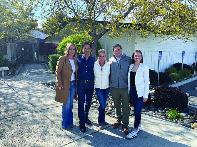 From left, Niki Wilcox of Nevada Commercial Services, property owner Dhaval Shah, Christy Locke with Nevada Commercial Services, and Blaise and Mallory LaBranch with Logic Commercial Real Estate at 1200 Mountain St., in Carson City on April 25.