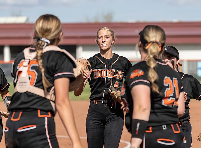 Douglas High School senior Cam McLelland talks to the Tigers during a mound visit Tuesday against McQueen.
