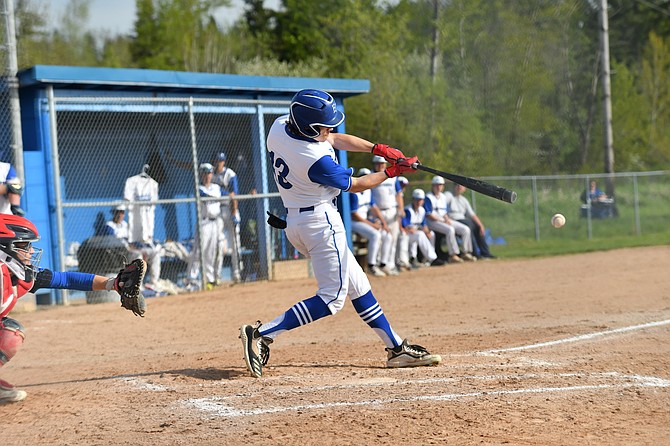 Eatonville's Brody Thirtyacre gets one of his three hits he recorded in a game against Washington last week.