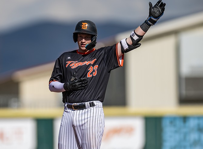 Douglas senior catcher Jeffrey Peters celebrates on second base earlier this season. Peters concluded his final season in a Tiger uniform with a team-high .379 batting average, 10 doubles and 19 RBIs.