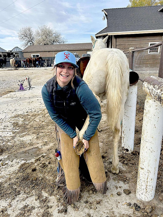 Xaraya Fristed teaching a foal how to stand so the pony can receive her first trim.
Photo special to The R-C