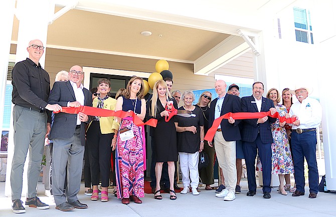 Officials from Valage Senior Living, the Carson Valley Chamber of Commerce and Douglas County cut the ribbon for the facility on May 8.