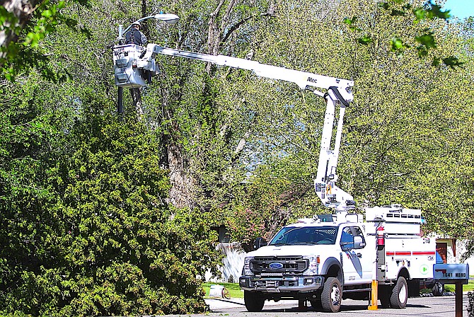 An NV Energy lineman works on Mono Avenue on Monday morning.