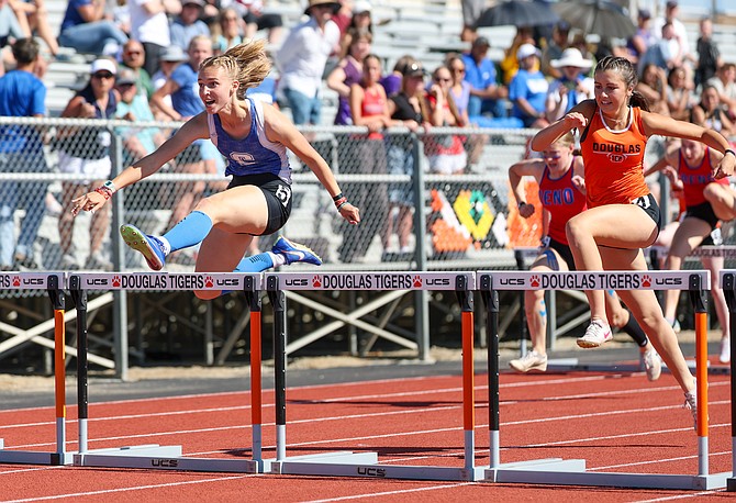 Carson High’s Anne Davis clears a hurdle during the Class 5A North regional 100-meter hurdles Friday. Davis won the regional title in 15.78.