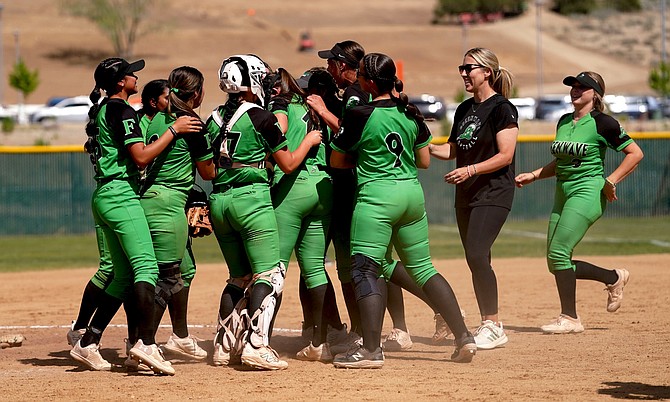 Fallon’s softball team celebrates its win over Lowry at the 3A regional.