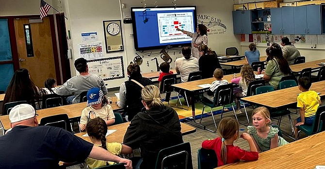 Lahontan Elementary School families sit in one of the informational sessions hosted by Principal Kimi Melendy during kindergarten registration night.