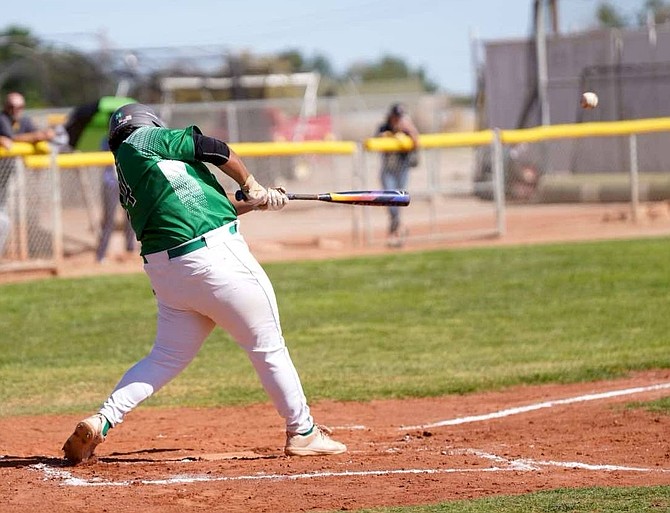 Fallon’s Eric Cornejo connects with a pitch against Boulder City on Thursday.