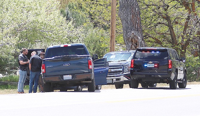 Authorities participate in a May 2 traffic stop on Jacks Valley Road just north of Genoa that resulted in the arrest of two men accused of online extortion and exploitation of the elderly.