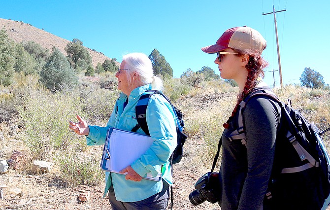 Western Nevada College instructor Robin Eppard and student Maile Pierson study pinyon jay habitat above Topaz Lake in 2024. A Genoa resident, Pierson is receiving her associates degree in science on Monday.