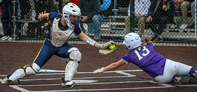 3A Districts: A tango at home plate as Everett Seagulls catcher senior Madeline Pewitt makes the tag at home on Edmonds-Woodway Warrior senior Ella Campbell during the Districts match up May 13 at the Phil Johnson Ballfields in Everett.
In the end, Edmonds-Woodway senior Abby McCorvey scored the game-winning run in the Warriors hard fought victory 9 - 8 over Everett in early District play.  Everett had a 2 tun lead at the top of the 10th inning with the game having been tied at several points in the extra innings.  The Warriors answered with 3 runs in the bottom of the inning to take the contest and advance in the tournament.
