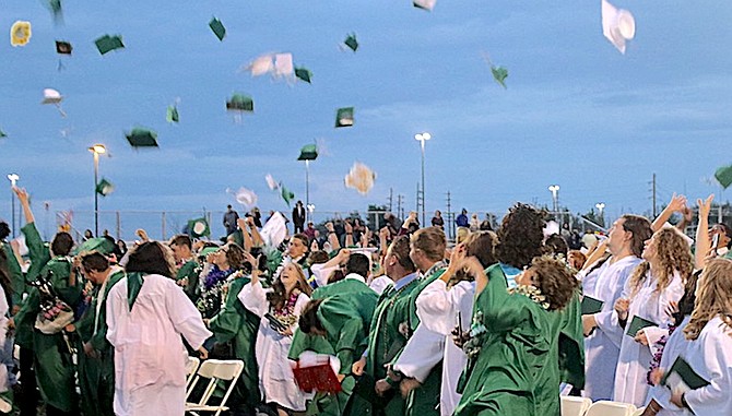 Students from a previous class celebrate their graduation at the Edward Arciniega Athletic Complex.