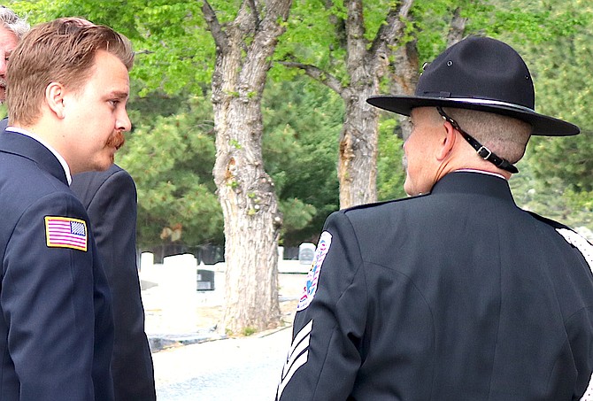 East Fork Fire Protection District bagpiper Christian Orozco talks to Douglas County Sheriff's Sgt. cellist John Lenz at Genoa's Memorial Day Observance on Monday morning.