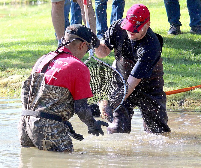 A big fish dives into Lampe Creek for the 2024 Kids Fishing Derby. The event is back this year.