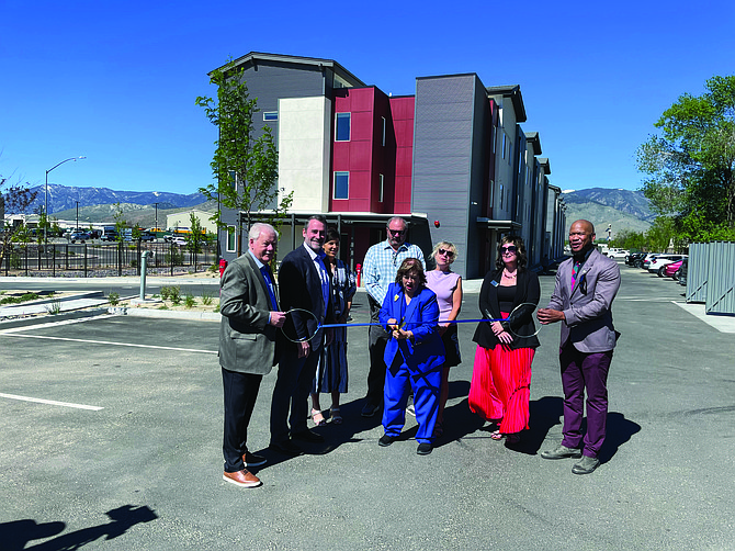 A ribbon-cutting ceremony at Sierra Flats in east Carson City on May 22. From left, former State Sen. Mike Schneider, Jeff Carpenter of OCM Builders and CM Development, Madeline Armstrong from Gov. Joe Lombardo’s office, Carson City Supervisors Stacey Giomi and Lisa Schuette and Mayor Lori Bagwell (center), Amanda Lakin with Nevada Housing Coalition and Chico Clark with Oikos Development Corp.