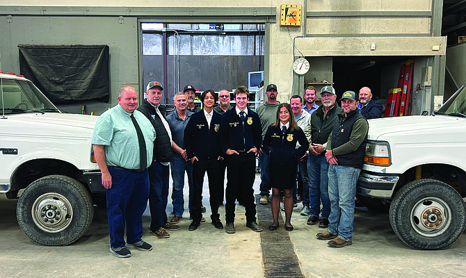 From left are Derild Parsons, school district superintendent; Mayor Ken Tedford, Commissioner Eric Blakey, Randy Sharp with Tedford Tire, Ag Mechanics student Alex Bacallo, Tim Spencer, CCHS principal; Ag Mechanics student Jackson Barbee, Nick Adams, County Road Department; Ag Mechanics student Madison Gregory, School District Board of Trustee Gregg Malkovich, Commissioner Myles Getto, Gary Fowkes, County Road Department supervisor; Joe Frey, County Planning Commission and Jim Barbee, county manager.