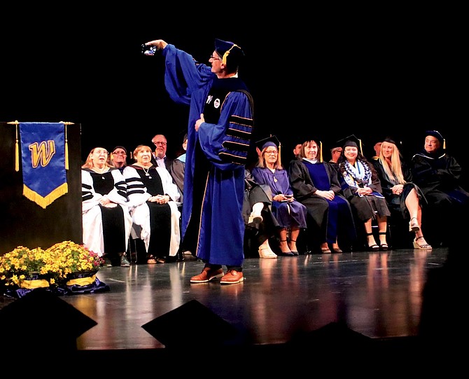 WNC President J. Kyle Dalpe takes a selfie with the Fallon graduates behind him at the May 21 graduation.