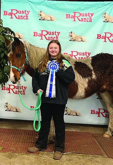Elouise Hemenway is being recognized for her achievements in the equine arena after being awarded the 2024 Junior World Reserve Grand Championship, an international honor.