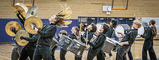 Hair flies on a cymbalist as members of the West Seattle High School Drumline lean back during their performance at the well-attended drumline competition Saturday, May 31 at Glacier Peak High School.